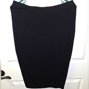 A Vince Camuto black tapered skirt in a size small. Rayon/Spandex blend